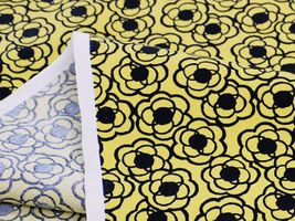 コットンこばやしブロードプリント「小さなくるくるフラワー」黄地