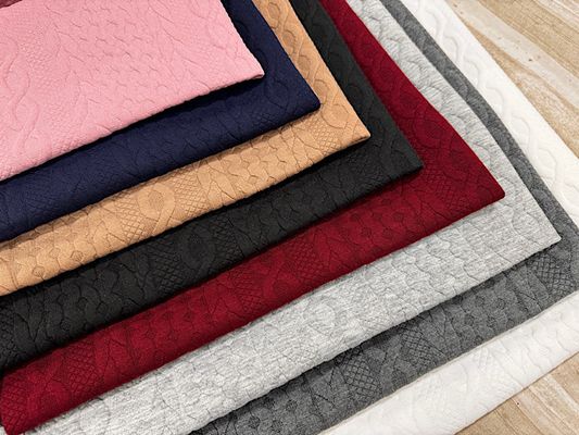 アラン風ロービングジャカードニット